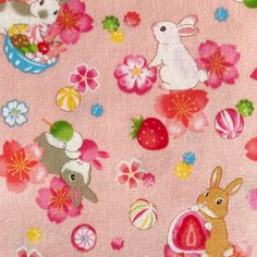 an image of a pink fabric with rabbits and flowers on it's back ground