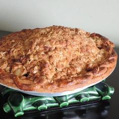 a pie sitting on top of a green plate