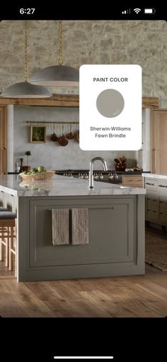 an image of a kitchen with gray cabinets and white counter tops on the phone screen