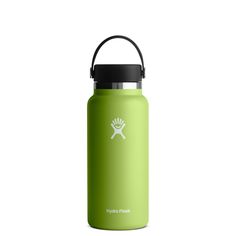 a green hydro flask water bottle with a black lid and handle on the side