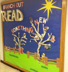 a bulletin board is decorated with newspaper strips and paper cutouts to read something new