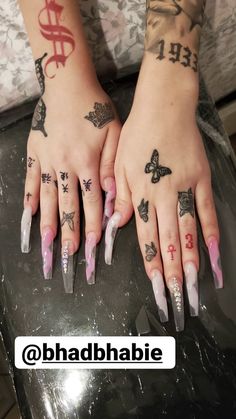 two hands with different tattoos on them