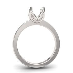 a white gold engagement ring with leaves on the side