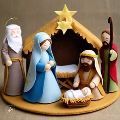 a nativity scene with three wise men and a baby jesus