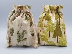 two bags with trees on them sitting next to each other