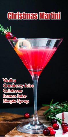 a christmas martini with cranberry juice and rosemary garnish