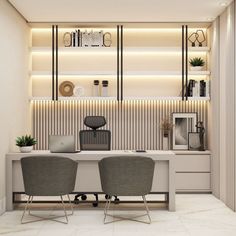 two gray chairs sitting at a desk in an office