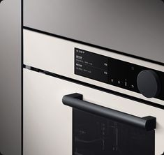 an oven with the door open and black knobs