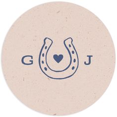 a round sticker with a horseshoe and the word god written in blue on it