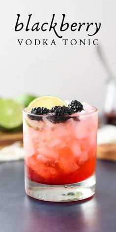 the blackberry vodka is garnished with blackberries and lime