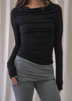 A draped neck long sleeve knit top. Made from a super stretchy semi sheer tencel. Features an asymmetric hem, extremely stretchy and soft. Boho Lifestyle, Long Sleeve Knit Top, Clare V., Long Sleeve Knit Tops, Long Sleeve Knit, Asymmetric Hem, Sustainable Fashion, Jumpsuit Dress, Knit Top