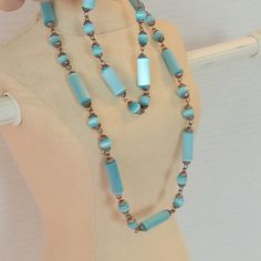 "Vintages is a lovely necklace and bracelet set in shimmering blue luster moonstones.  the blue beads have a very pretty milky blue luster shade to them. The beads are in cylinder and round shapes in a Sterling Silver chain. The clasp is marked 925. The necklace measures about 17\" long and the bracelet measures about 8\" long. This lovely set is in very good vintage condition." Necklace And Bracelet Set, Moonstone Beads, Necklace And Bracelet, Lovely Necklace, Beads Necklace, Moon Stone, Blue Beads, Silver Blue, Sterling Silver Chain