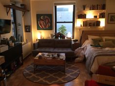 a living room filled with furniture and a flat screen tv