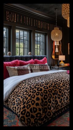 a bedroom with leopard print bedding and chandelier