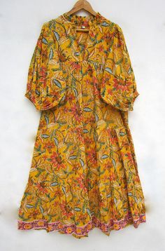 ITEM DESCRIPTION summer mango yellow flower printed maxi dress - v neckline summer dress - 3/4th sleeve with button maxi  Features: 3/4th sleeve, V neck, Long dress Fabric: 100% Cotton cambric hand block printed fabrics  Sleeve Length = 18 inch For more sizes & their measurement, please refer our below chart to understand the sizes variations available with us For your size requirement, please mention your size in seller note at the time of buying. SIZE MEASUREMENT  BUSTLENGTHSHOULDER XXS34 inch Summer Floral Print Half Sleeve Maxi Dress, Summer Half Sleeve Maxi Dress For Beach, Summer Half Sleeve Maxi Dress For Brunch, Floral Print Half Sleeve Maxi Dress For Vacation, Half Sleeve Floral Maxi Dress For Vacation, Yellow Floral Print Maxi Dress For Vacation, Mustard Floral Print Maxi Dress For Brunch, Yellow Half Sleeve Dress For Spring, Yellow Half Sleeve Spring Dress