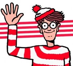 a man wearing glasses and a red striped shirt is holding his hands up in the air