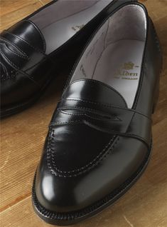 Classic Black Slip-ons With Brogue Detailing, Classic Black Slip-ons With Leather Sole, Classic Black Loafers With Leather Footbed, Classic Slip-on Leather Shoes For Galas, Classic Leather Slip-on Shoes For Galas, Classic Slip-ons With Leather Sole For Galas, Classic Black Slip-ons For Galas, Black Classic Slip-ons For Galas, Classic Wingtip Slip-ons For Galas