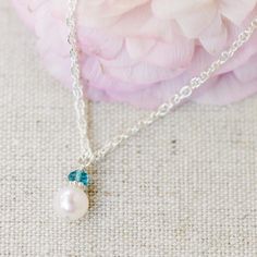 A beautiful freshwater pearl is topped with a shiny sterling silver daisy and a faceted genuine birthstone gemstone, making it extra personal. How sweet would this be for her birthday? Gorgeous hand-chosen AAA grade centerpiece pearl is approximately 7mm and is topped with a 3.5mm(ish) genuine gemstone. So pretty! Pearl Necklaces With Faceted Detail As Gift, Delicate Sterling Silver Birthstone Necklace For May, Elegant Faceted Birthstone Necklace In Sterling Silver, Dainty Pearl Jewelry For Birthdays, Dainty Pearl Jewelry With Birthstone, Dainty Pearl Jewelry For Birthday, Silver May Birthstone Necklace For Wedding, White Birthstone Necklace For Birthday Gift, Sterling Silver May Birthstone Necklace For Wedding