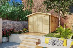 a wooden shed sitting on top of a lush green field next to a brick wall