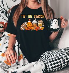 Embrace the festive spirit year-round with our "Tis the Season" pumpkin-themed tee! This unique shirt blends the spooky charm of Halloween with the cozy cheer of Christmas, featuring a whimsical pumpkin adorned with Christmas elements. It's perfect for those who love celebrating both holidays with equal enthusiasm. Crafted from premium, soft fabric, this tee ensures comfort and durability while making a statement. Whether you're into Halloween pumpkins, dancing skeletons, or just looking for a f Unique Shirt, Pumpkin Theme, Pumpkin Design, Tis The Season, Jersey Shorts, Short Sleeve Shirt, Unisex Sweatshirt, Breathable Fabric, Short Sleeve Tee