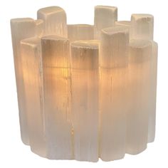 an image of a glass vase that is made out of wood and frosted with light