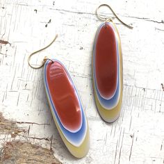 Ombre' resin that looks like agate, drop earrings made of vintage parts from India - made in the 1970's. Rusty orange meets yellow, white & a touch of blue. These pieces are similar to Fordite in the polished layers of color. Earwires are hypoallergenic and 24k frosted gold plated. Each earring measures about 3.5" from end to end. Earrings are made with vintage lucite & resin parts, originally created for the jewelry industry between the early 60's through the early 80's. No new plastics Cheap Vintage Orange Earrings, Retro Handmade Orange Earrings, Handmade Retro Orange Earrings, Retro Teardrop Earrings As Gift, Mid-century Handmade Earrings As Gift, Handmade Mid-century Style Earrings For Gifts, Handmade Mid-century Earrings As Gift, Retro Teardrop Earrings, Retro Multicolor Hand Painted Earrings