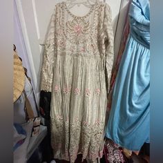 Extremely Beautiful Set!!! Wedding Ceremony Pakistani Outfit. Includes Dress, Dupatta, And Pants Used Once! Bead Work Is Intricate, By Hand & Whole Outfit Is A Bit Heavy! But Comfortable Enough To Wear The Whole Night! This One Is Size L My Measurements Are 40” Chest 36” Waist 43” Hips. My Size Is 14/16! Fitted Floor-length Wedding Dress With Dupatta, Floor-length Dress With Pearl Embroidery For Wedding, Pearl Embroidered Floor-length Wedding Dress, Floor-length Pearl Embroidered Wedding Dress, Beige Wedding Dress With Intricate Embroidery, Fitted Resham Embroidery Wedding Dress, White Gown With Dabka Work For Party, Beige Anarkali Dress For Wedding, Beige Resham Embroidered Wedding Dress