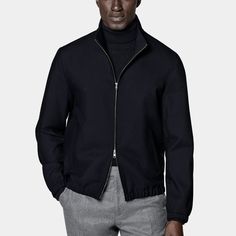 A stylish, versatile layer
  that's perfect for the seasonal transition, this relaxed navy bomber jacket
  is unconstructed for a lightweight wear and undeniably casual appeal. Navy Outerwear With Ribbed Collar For Fall, Navy Outerwear With Ribbed Cuffs For Fall, Navy Business Outerwear For Spring, Modern Outerwear With Ribbed Cuffs For Work, Spring Track Jacket With Zip Cuffs For Work, Relaxed Fit Track Jacket For Workwear In Spring, Casual Track Jacket With Zip Cuffs For Work, Classic Spring Outerwear With Zip Cuffs, Business Outerwear With Zip Cuffs For Fall