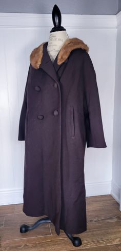 Brown wool coat with raglan sleeves and mink collar. Length is 41" from neck to hem. 4 wool covered buttons  with one button dented. Easy to modernize with new buttons. 4 in all, Winter Outerwear With Covered Buttons And Lapel Collar, Classic Winter Wool Coat With Faux Fur Trim, Classic Wool Coat With Covered Buttons For Winter, Winter Outerwear With Covered Buttons In Solid Color, Winter Solid Outerwear With Covered Buttons, Classic Wool Coat With Faux Fur Trim, Formal Wool Coat With Faux Fur Trim, Classic Wool Outerwear With Faux Fur Trim, Classic Winter Pea Coat With Covered Buttons