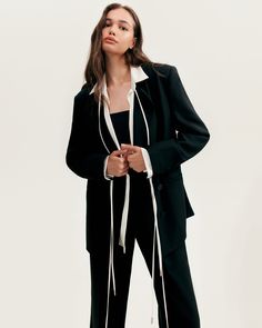 A deep affection for refined and timeless fashion influences the craftsmanship and quality of this style. Made from suit fabric, these black pants are made in a high-rise style to lengthen legs. For a completely stylish look pair your pants with a black boyfriend blazer. Details: Material: Suit fabric Fabric composition: 100% Polyester Silhouette: Relaxed Length: 43.7 inches / 111 cm Lining: High waist straight fit Model is 179 cm / 82-62-93, wearing size S Average dress weight 2.44 lbs / 1.11 k Chic High-waisted Evening Suits, Chic Evening Suits With High-waisted Pants, Black Spring Office Suit, Elegant Black Spring Suit, Elegant Black Suit For Spring, Chic Black Notch Lapel Pantsuit, Black Fall Workwear Tuxedo, Chic Black Suit With Notch Lapel, Black Tuxedo For Workwear In Fall