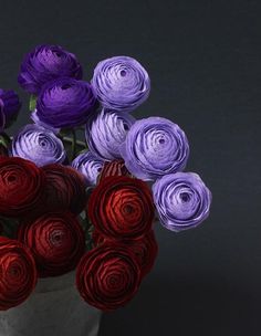 purple and red paper flowers in a vase