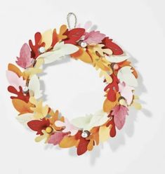 a wreath made out of paper with leaves on it