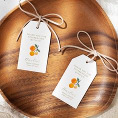 two tags on a wooden platter that say thank you for the oranges