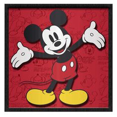 a mickey mouse cutout in a black frame with red and yellow wallpaper behind it