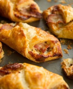 ham and cheese pastries on a baking sheet