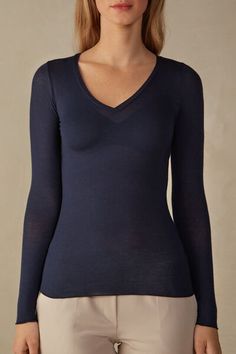 Long sleeve V-neck top in modal ultralight with cashmere. Soft, ultra lightweight fabric. Softly hugs the body.
The model is 5’ 9” (175 cm) tall and is wearing a size S. Feminine V-neck Camisole For Loungewear, Modal V-neck Top For Loungewear, Chic Seamless V-neck Camisole, Blue V-neck Camisole For Daywear, Elegant Long Sleeve Cashmere V-neck Sweater, Jennifer Lopez News, Italian Lingerie, Lingerie Collection, Target