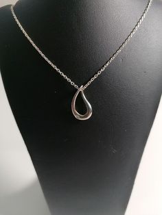 9ct White Gold Diamond Pendant on an 18" Silver Chain. Hallmarked. Classic Oval Drop Necklace Gift, Classic Oval Drop Necklace For Gift, Classic Necklaces With Polished Teardrop Pendant, Classic Teardrop Pendant Necklace With Polished Finish, Classic Silver Drop Necklace As Gift, Classic Drop Necklace As Gift, Formal Hallmarked Teardrop Necklace, Formal Drop Necklaces With Polished Finish, Classic Sterling Silver Drop Necklaces