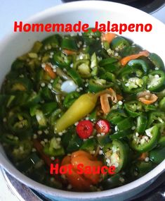 a white bowl filled with vegetables on top of a stove