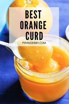 an orange curd in a glass jar with a spoon full of it and the words, best orange curd