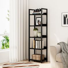 a living room filled with furniture and a white rug on top of a wooden floor