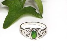 "My Celtic Emerald Green CZ Gemstone ring was created in solid Sterling Silver. The front of the ring is set with an oval faceted Emerald green cubic zirconia cab and is framed with a Celtic Trinity knot on each side of the stone. The face of the ring measures 8mm or .31 inches. Please select your size from the drop down menu. ~The color in this ring is a true Celtic or Irish green and is the birthstone for May. ~The Celtic Trinity or Triquetra symbolizes the \"Trine\" or the \"Three\". It consi Classic Adjustable Green Emerald Ring, Green Birthstone Ring For Promise, Green Opal Promise Ring, Emerald Green Ring, Celtic Ring, Trinity Ring, Celtic Trinity Knot, Green Ring, Trinity Knot