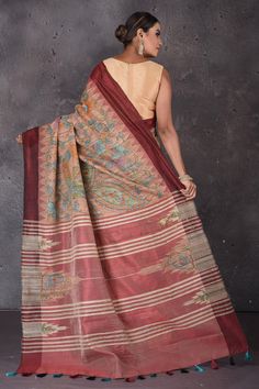 Flaunt ethnic look on festive occasions in this elegant dusy pink hand painted Kalamkari Gicha silk saree. The saree has a contrasting maroon border. It comes with a matching blouse piece. Shop silk arees in USA from Pure Elegance. Disclaimer: The shown stitched blouse on the model is for display purpose only. The saree comes with a matching blouse piece and finished with fall and piko. Tussar Silk Pre-draped Saree With Kalamkari Print, Festive Kalamkari Print Tussar Silk Saree, Festive Kalamkari Print Pre-draped Tussar Silk Saree, Red Katan Silk Saree With Printed Border, Red Tussar Silk Dupatta With Printed Border, Traditional Brown Saree For Navratri, Red Art Silk Saree With Kalamkari Print, Red Katan Silk Saree With Kalamkari Print, Red Chanderi Saree With Kalamkari Print