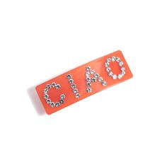 Elevate your everyday look with the Ciao Barrette in vibrant coral. This chic accessory, measuring 3" in length and 1" in width, is a delightful blend of glass and alloy. Brought to you by Shiraleah, a brand renowned for creating lifestyle products that add a special touch to your life. Whether you're running errands or attending a special event, this barrette adds a pop of color and sparkle to your hair. It's the perfect way to keep your locks in place while showing off your personal style. Del Chic Red Summer Jewelry, Elegant Orange Glass Jewelry, Trendy Coral Jewelry For Summer, Trendy Coral Summer Jewelry, Chic Glass Jewelry As Gift, Trendy Red Glass Jewelry, Icon Shoes, Boot Jewelry, Lifestyle Products