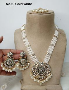 *Light Weight Gold Rani Haar Necklace Set. *No.1- Gold white rani haar *Haar length: 11 inches (including pendant) *Pendant Breadth- 2.2 inches *Earrings length: 1.9 inches  (with drops) ;   *earrings Width: 1 inches White Round Necklaces For Festivals, White Kundan Round Necklaces, Traditional White Necklaces For Eid, White Bridal Necklace For Eid Festival, White Bridal Necklace For Eid Festivities, Festive White Bridal Necklace For Eid, White Kundan Jewelry For Eid, White Kundan Necklace For Eid Gift, White Long Necklace Jewelry For Festive Season