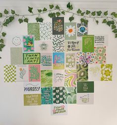 a white wall covered in lots of different types of cards