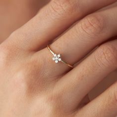 One of our latest designs, our new dainty flower design with natural round diamonds is truly a piece to enjoy every day.★ Ring Features• Gold Kt: 14K Solid Gold (All rings are stamped for authenticity)• Available Gold Colors: Yellow Gold, White Gold, Rose Gold• Total Diamond Weight: 0.12 carat• Diamond Color-Clarity: G Color VS2/SI1 Clarity• Band Width: 1.2 mm• Face Dimensions: 5.8 mm by 5.8 mm / 0.23 Inch by 0.23 Inch Simple Floral Engagement Ring, Small Diamond Ring Design Simple, Rings Real Gold, Dainty Flower Engagement Ring, Dainty Flower Ring, Gold Ring With Small Diamond, Dainty Rings Gold, Dainty White Gold Flower Ring, Minimalist White Gold Flower Ring