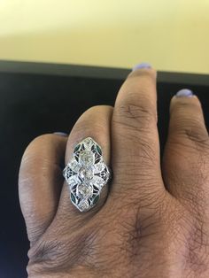 20k White Gold Ring, with 9 diamonds totaling approximately .50ct. SI2 clarity j- k colors. 4 emeralds Marquise shape totaling approx. 1/3ct. Circa 1920s-1930s. Ring is a size 7 but can be sized up or down two sizes at no additional cost. Green Diamond Cut Diamond Ring, Green Diamond Ring With Single Cut Emerald Shape, Green Emerald Cut Diamond Ring With Single Cut Diamonds, Diamond White Multi-stone Oval Diamond Ring, Oval Multi-stone Diamond White Diamond Ring, Oval Multi-stone Diamond Ring In Diamond White, Green Diamond Ring With Diamond Accents, Green Diamond Ring For Formal Occasions, Emerald Cut Green Cluster Ring With Diamond Accents