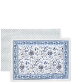 two place mats with blue and white designs