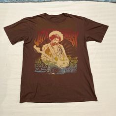 Y2k Early 2000s Jimi Hendrix Chocolate Brown Paychadeloc Colorful Graphic Tee! Mallgoth Affliction Grunge Skater Ash Grey Longsleeve! Tony Hawk Music Jnco Surfer Size Medium! Sucha Sick Piece !! Absolutely Love The Chest Graphic Hit And The Back Graphic Are Sooo Sick! #Music #Skater #Grunge #Cyber2k #Mallgoth Y2k Cotton T-shirt For Music Festivals, Y2k Style Cotton T-shirt For Music Festival, Y2k Graphic Print Tops For Festival, Y2k Style Graphic Print Tops For Festivals, Brown Y2k Tops With Graphic Print, Brown Short Sleeve Y2k Top, 90s Style Short Sleeve Festival Tops, 90s Style Short Sleeve Tops For Festival, Brown Graphic Print Top For Festival