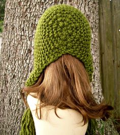 "Style: Chunky bonnet style hat with fluffy tassels in each ear flap corner. Color: This sample hat is shown in Cilantro. You can choose from 34 colors. Please see the last photo in the listing and zoom in for a visual reference of your color choices, then select it from the drop down menu when ordering. Sizes: One size fits average teen or adult head size of 20\" to 23\" (50.5 cm to 58 cm). Fiber Content: 80% acrylic, 20% Wool Characteristics: Chunky, very soft, warm and cozy. Care Instructions Crochet Baby Bonnet, Beanie Hat Pattern, Flap Hat, Visual Reference, Knit Hat For Men, Crochet Aesthetic, Chunky Knit Hat, Ear Flap Hats, Mens Hat